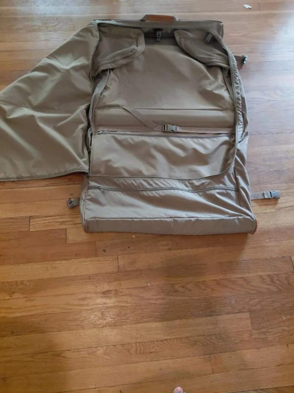 Features 2 deep front pockets with exterior/ interior zipper compartments galore